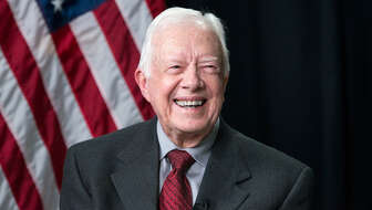president-jimmy-carter-flag-bg.jpg?sw=336&cx=0&cy=77&cw=1200&ch=679&q=60